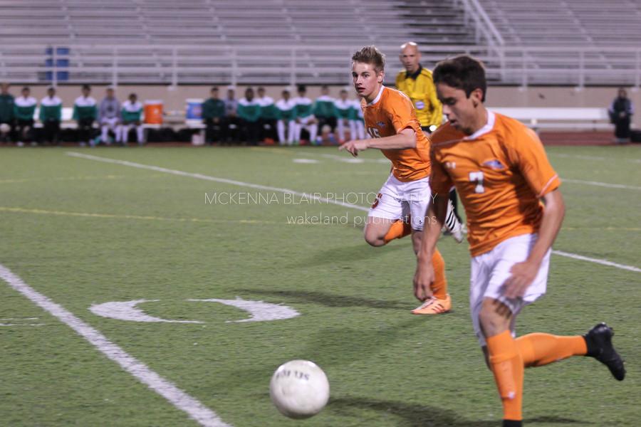 Junior Zach Ladwig powers the ball up the field.