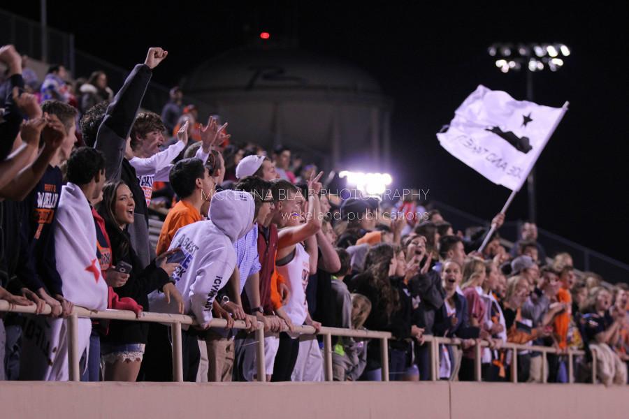 The student section roars as penalty kicks rise to a climax.
