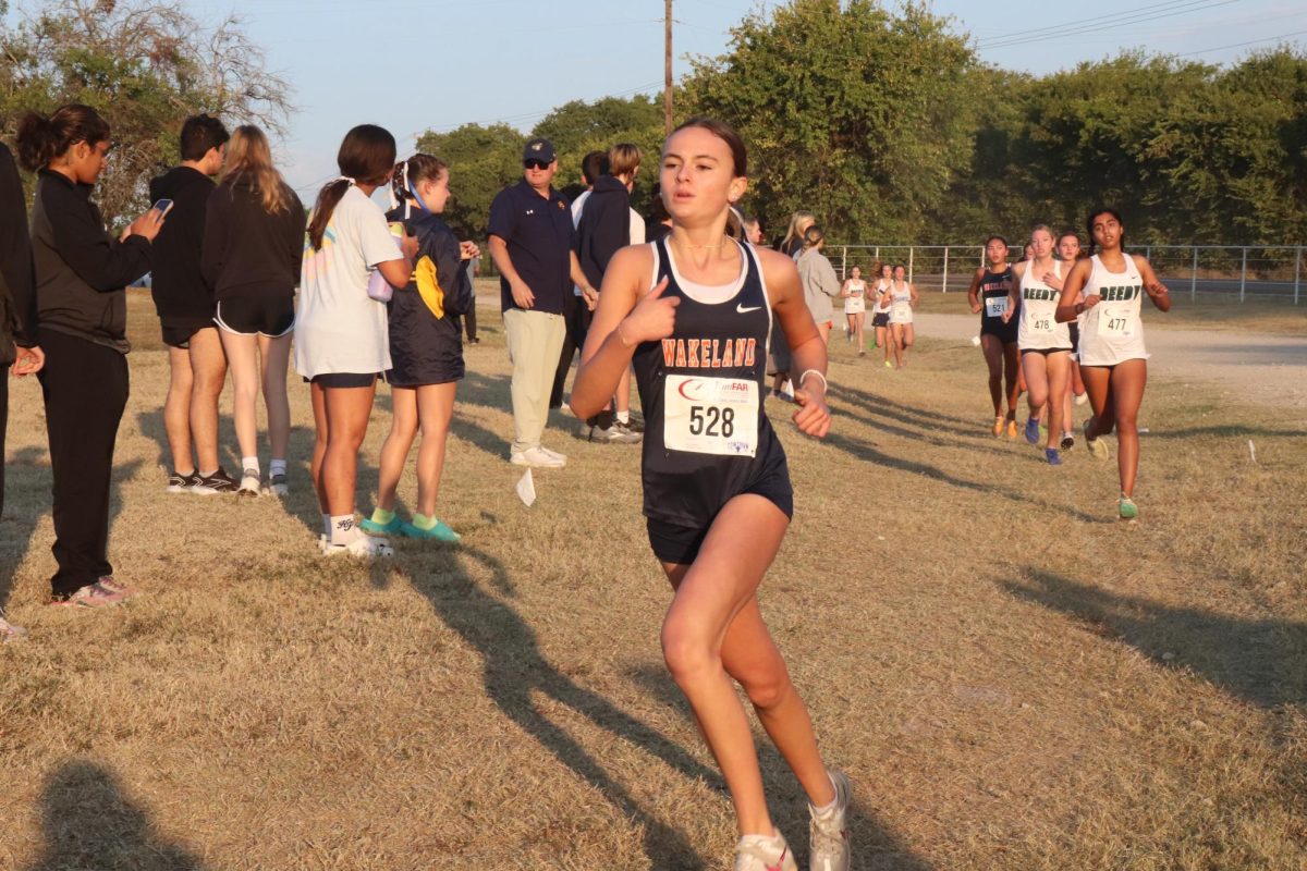 Freshman Lily Schmidt takes a comfortable lead at the district meet in McKinney on October 10.