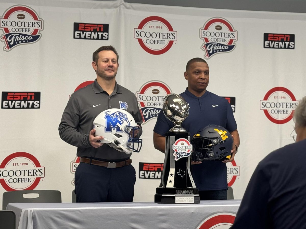 Coaches for the Memphis Tigers [Ryan Silverfield] and West Virginia [Chad Scott] attend a press conference at Toyota Stadium on Monday, Dec 16.