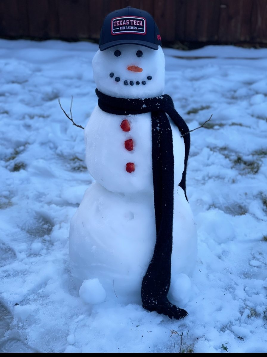 Winter Raider Pride! A snowman sports Texas Tech spirit in this frosty capture by photojournalist Kerr Swarbrick.