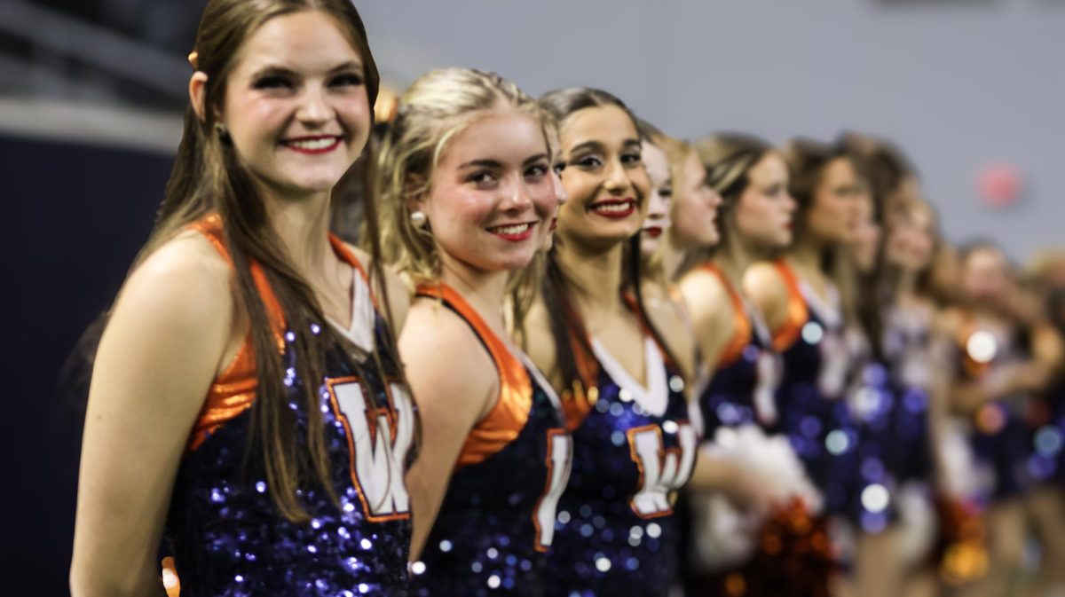 Ella and teammates line up before taking the field at the first playoff game of the season. 