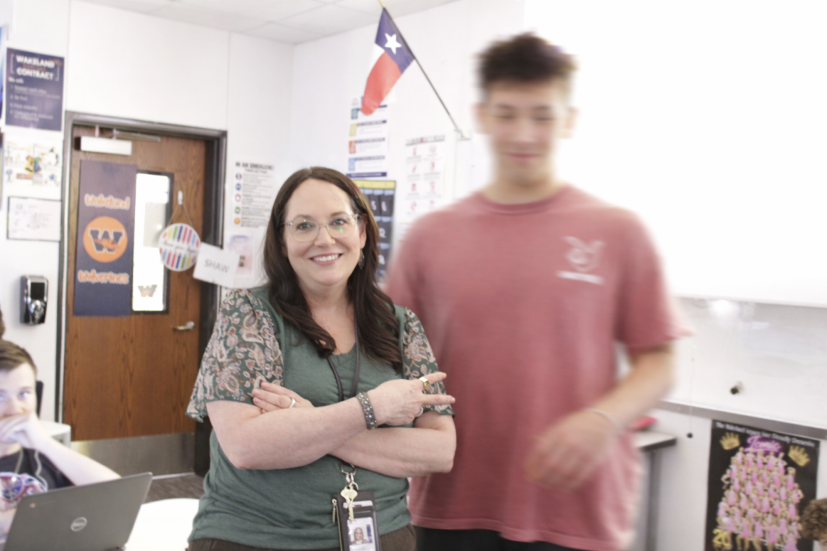 Ms. Hillrichs with one of her students. Student identities are protected through intentional blur. Ms. Hillrichs is a case manager that supports her students in the classroom and one-on-one. She says the most important part of her job is "understanding how each one of them learns best."